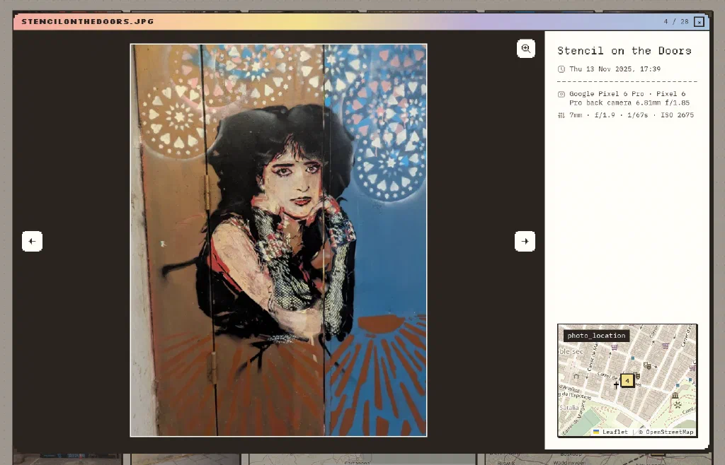 The gallery lightbox showing a stencil of a woman on wooden doors, with the photo's title, date and camera details beside it, and a small street map with the photo's numbered pin.